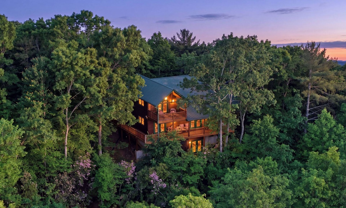 Ridgeline Vistas Cabin | Cozy mountain views, 4 king beds, hot tub, game room, fire pit, porch fireplace