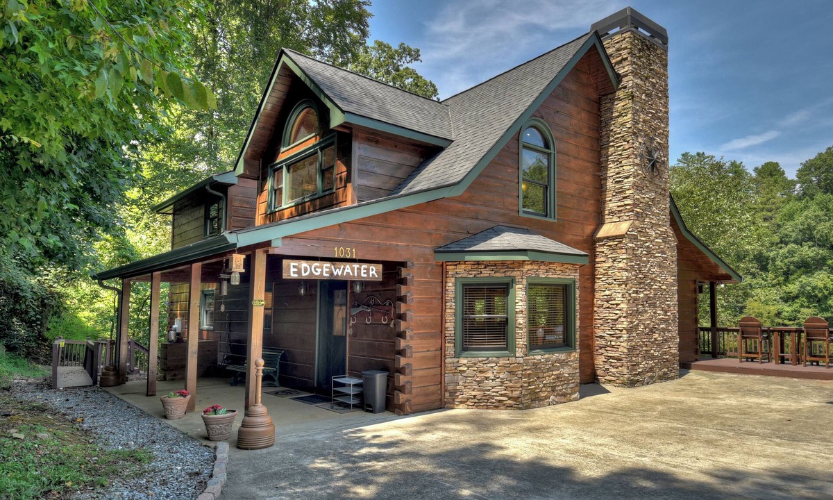 Ellijay Cabin | Ideal for large families, this riverfront gem boasts a dock, firepit, hot tub, basketball court, and a pool table for endless fun. Pet Friendly and WiFi