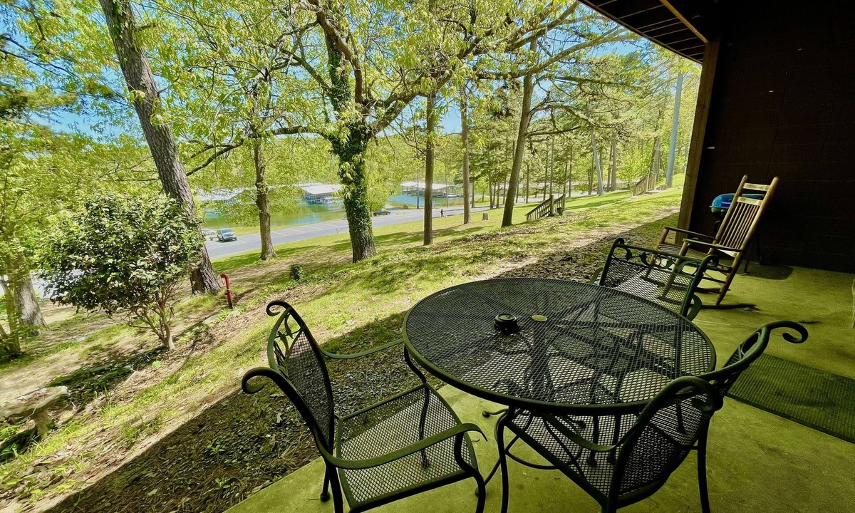 Mount Ida Cabin | King Studio with king bed, dining area, sleeper sofa and view of Lake Ouachita by RedAwning