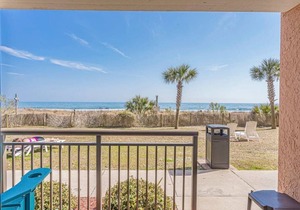 Great 1st floor unit that looks right out onto the beach with direct access