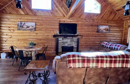 Louisa Cabin | Beautiful cabin with fireplace and wrap around porch and private upstair balcony
