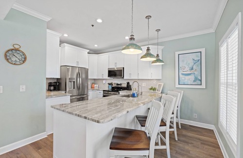 Ocean Isle Beach Villa | Castaway the Day - Second Row -closest walk to beach access, pool, and tiki bar!