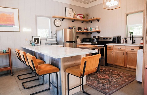 Kerr House | Clean and cozy barn home nestled in the trees with peaceful outdoor spaces!