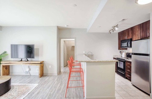 Central Business District Apartment | CozySuites at the Banks gym, pool 16