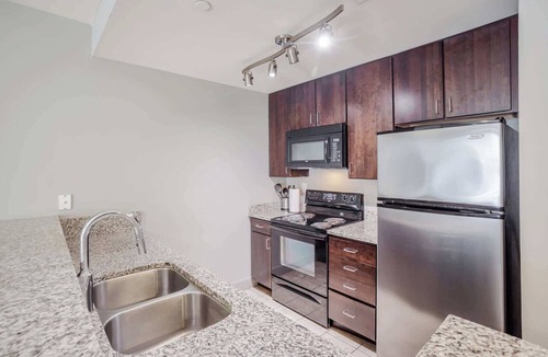 Central Business District Apartment | CozySuites at the Banks gym, pool 16