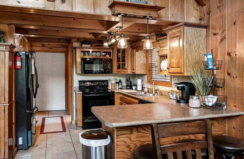 Flat Hollow Marina Cabin | Deluxe Cabin with Three Stunning Decks for a Group Getaway on Norris Lake, Tennessee