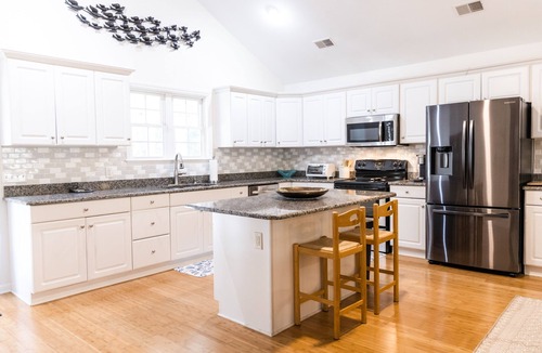 Ocean Ridge House | Exceptional 4 bedroom coastal cottage with heated pool access, walk to the beach