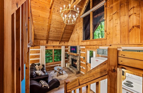 Sevierville Cabin | Gingerbread log cabin! Hot tub/projector/fire pit/king bed/yoga chair, ROMANTIC!