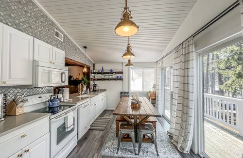Blakeslee House | Iconic Cabin! Hot tub, fire pit, lakefront, dock, pet friendly and more!