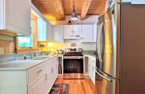 Asheville Cabin | Mountain cabin with 3 bedrooms, 2 baths, fire pit, porch swing.