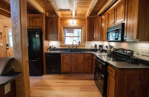 Dawsonville Cabin | Riverfront Log Cabin with Treetop Views near Dahlonega- Hot Tub, Firepits, more!