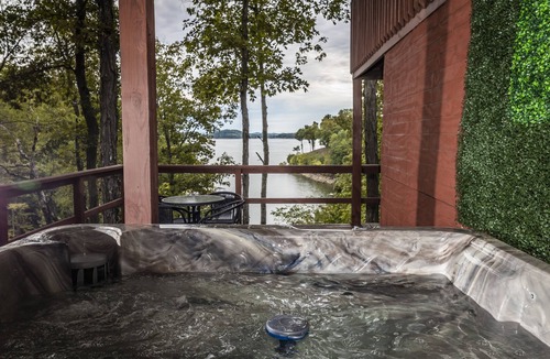 Sevierville Cabin | Rustic Lakefront Cabin near Smokies w/Hot Tub, Firepit, Pool Table + Views!