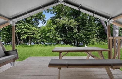New River RV Rental | Safari Tent Retreat with Riverfront Deck and Nature Stay in Blacksburg, Virginia