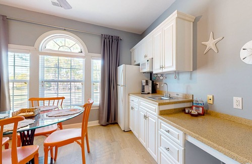 Sea Trail Apartment | SB72B: Coastal Suite with golf course view and shared pool access