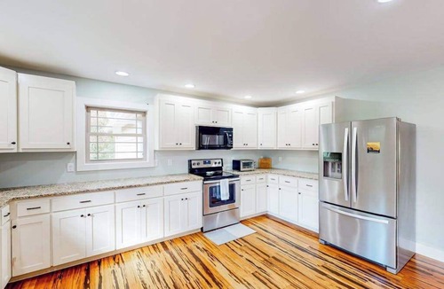 Pisgah Forest House | Scenic retreat with private hot tub, fenced yard, fire table, & furnished porch