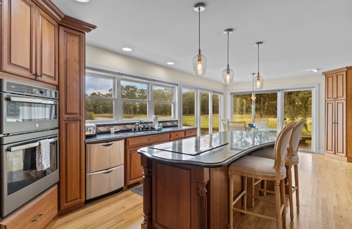 Sea Trail House | Shining Waters: Gorgeous waterfront home with private hot tub, pool, views, deck, & fireplace