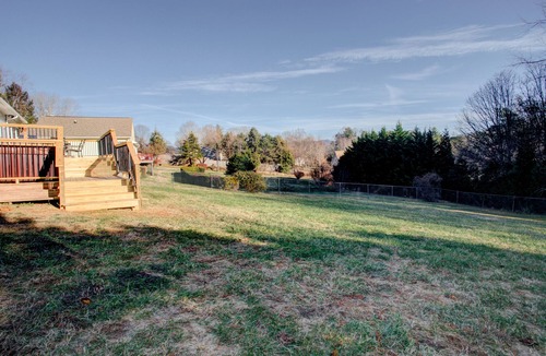 Oakley House | The Pink House on Floyd - 3 bedroom with hot tub, large deck, and fenced yard.