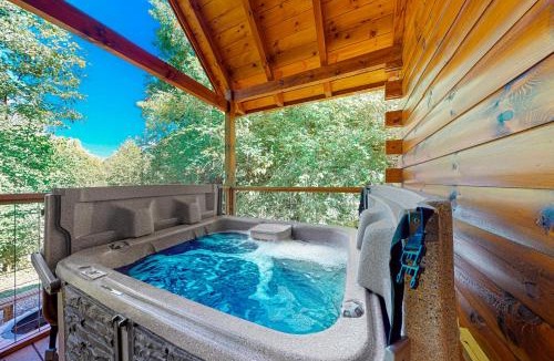 Chalet Village North House | Wooded cabin with Hot Tub, Fireplaces & Furnished Deck