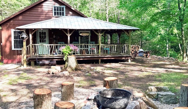 Cabin on Mountain Stream, Surrounded by Forest