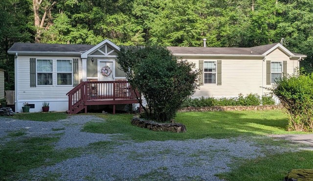 Charming 4-bedroom modular home in Summersville, WV with private creek access.