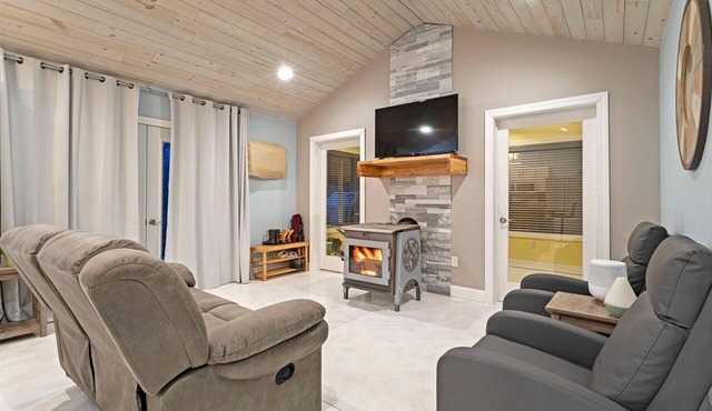 Cozy one level - open floor plan, split bedrooms, in-floor heat, wood stove in Mora