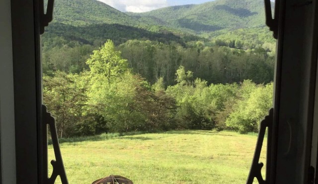 Find your serenity at this mountain cottage with river access.