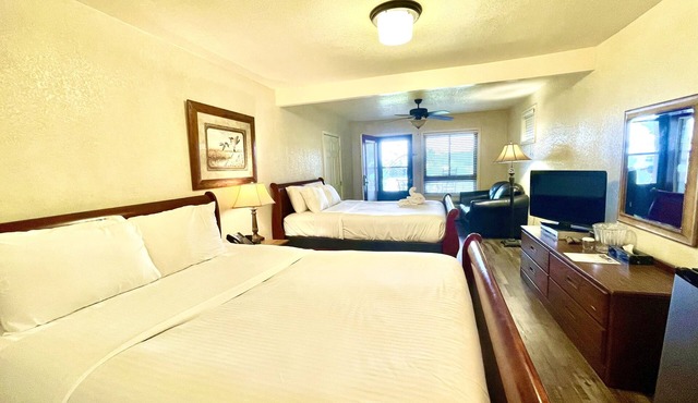 Lake view queen Guest Room with two queens, sleeper sofa and deck overlooking Lake Ouachita. by RedAwning in Mount Ida