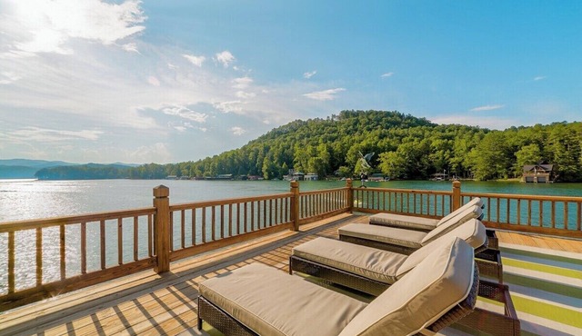 Lakefront 4BR, 4.5BA retreat with boathouse, fire pit, and serene Lake Burton views.