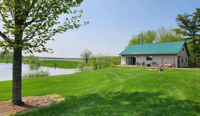Peacefully secluded cabin on a small private lake with 55 Acres in Barronett