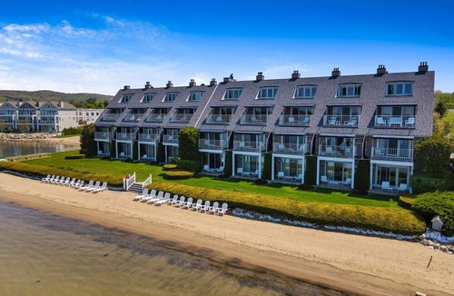 Boyne City Condo | 112 Water Street | Lake Charlevoix Views | Private Patio and Beach |