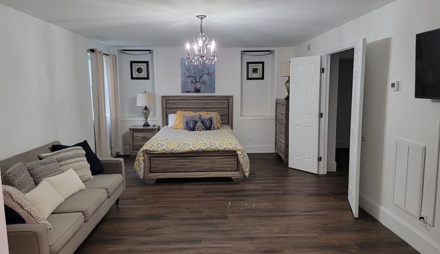 Charming brick home set in the woods on 45 acres with pond and trails.