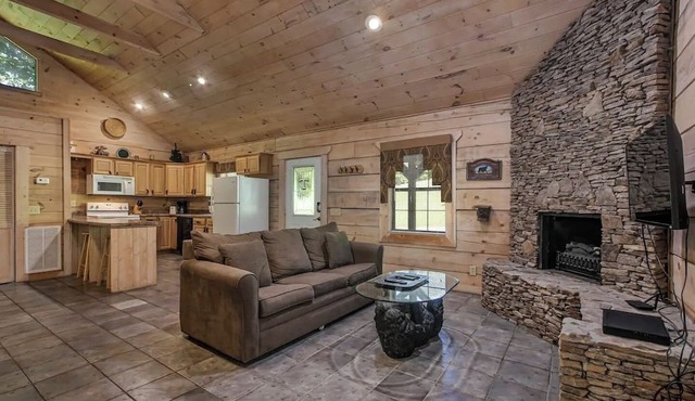 Bear cabin. This modern log cabin with HOT TUB is a large studio with a spectacular king size bed!