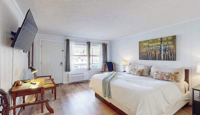 Dog-friendly lakefront condo with pool, canoes, & WiFi - in a perfect location