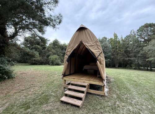 Canvas Cabin with Fire Pit for a Cozy Glamping Escape in Branchville, South Carolina